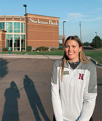 Shyan Lorin Krass in front of Stockman Bank